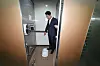 Seoul Mayor Oh Se-hoon looks at a squat toilet inside the public restroom in Jamsil Station in southern Seoul on July 23. [NEWS1]