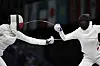 Poland's Aleksandra Jarecka, left, competes with China's Xu Nuo in the women's team epee bronze final match at the Grand Palais in Paris on Tuesday. [AP/YONHAP]