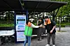 A Nowon district official hands out a free bottle of water to a passerby at a park in Nowon District, northern Seoul, in summer 2024. [NOWON DISTRICT OFFICE]