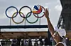 Spain's Pablo Herrera Allepuz serves during a men's pool F beach volleyball match between France and Spain at Eiffel Tower Stadium in Paris on Tuesday. [AP/YONHAP]