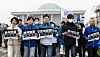 Democratic Party (DP) floor leader Rep. Park Chan-dae, center, and other DP lawmakers hold up placards urging the Constitutional Court to uphold President Yoon Suk Yeol's impeachment as they march in front of the National Assembly in Yeouido, western Seoul, on March 25. [NEWS1]
