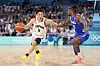 Japan's Yuki Kawamura, left, drives past France's Andrew Albicy in a men's basketball game at the Paris Olympics in Villeneuve-d'Ascq, France on Tuesday. [AP/YONHAP]