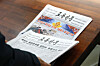 A man picks up a copy of the Rodong Sinmun, the official newspaper of North Korea's ruling Workers' Party, at the National Assembly Library in Yeouido, western Seoul, on Jan. 7. [YONHAP]