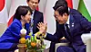 President Lee Jae Myung, right, speaks with Japanese Prime Minister Sanae Takaichi ahead of their pull-aside meeting held on the sidelines of the Group of 20 summit in Johannesburg, South Africa, on Nov. 23. [JOINT PRESS CORPS]