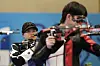 Korea's Keum Ji-hyeon, left, and teammate Park Ha-jun compete in the 10-meter air rifle mixed gold medal round at the 2024 Paris Olympics on Saturday in Chateauroux, France. [AP/YONHAP]