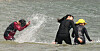 Citizens enjoy a water fight at the Gwangalli Beach in Busan on June 27. [YONHAP]