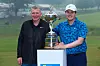 Robert MacIntyre, right, poses with the trophy alongside his caddie and father Dougie MacIntyre after winning the RBC Canadian Open at Hamilton Golf & Country Club in Hamilton, Ontario, Canada on Sunday. [GETTY IMAGES]