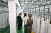 North Korean leader Kim Jong-un, center left, views centrifuges at a uranium enrichment facility in an image provided by the North's official Korean Central News Agency (KCNA) on Friday. [YONHAP]