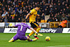 Wolverhampton Wanderers' Hwang Hee-chan in action with Everton's Jordan Pickford during a Premier League game at the Molineux in Wolverhampton, England on Saturday.  [REUTERS/YONHAP]