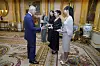 Britain's King Charles III, left. presents the members of the K-Pop band Blackpink with MBEs, Member of the Order of the British Empire at Buckingham Palace, in London, Wednesday, Nov. 22, 2023. [AP/YONHAP]