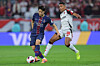 Lee Kang-in of Paris Saint-Germain, left, battles Alex Sandro of CR Flamengo for the ball during the final of the FIFA Intercontinental Cup at Ahmad bin Ali Stadium in Al Rayyan, Qatar, on Dec. 17. [AFP/YONHAP]
