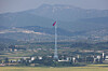 A North Korean flag flies over Kijong-dong in the demilitarized zone’s western front, seen from the Dora Observatory in Paju, Gyeonggi, on Sept. 3. [YONHAP]