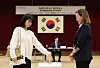 A voter, left, casts her ballot at a polling station at the Korean Embassy in Tokyo on May 20, the first day of overseas voting for the 21st presidential election. [YONHAP]