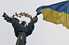 A Ukrainian national flag waves in front of the Independence Monument, amid Russia's attack on Ukraine, in Kyiv, Ukraine, on Nov. 26. [REUTERS/YONHAP]