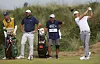 Haotong Li (right) tees off in front of Scottie Scheffler on the seventh hole during the final round of The 153rd Open Championship at Royal Portrush in Ireland on July 20. [REUTERS/YONHAP]