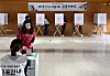 Voters living in China cast their ballots votes at a polling station at the Korean Embassy in Beijing on May 20, the first day of overseas voting for the June 3 presidential election. [YONHAP]