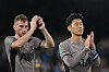 Tottenham Hotspur's Son Heung-min, right, and Dejan Kulusevski applaud at the end of a Carabao Cup match between Fulham and Tottenham at Craven Cottage in London on Tuesday. [AFP/YONHAP]
