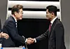 Democratic Party presidential candidate Lee Jae-myung, left, shakes hands with People Power Party presidential candidate Kim Moon-soo before the second presidential debate hosted by the National Election Broadcasting Debate Commission at the KBS studio in western Seoul on May 23. [NEWS1]