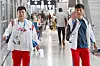 A member of the North Korean delegation for the 2024 Paris Olympics holds up his hand at reporters as he arrives at Paris Charles de Gaulle Airport in France on Saturday. [JOINT PRESS CORPS]