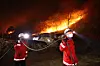 Firefighters contain a wildfire that originated in nearby Uiseong County in the city of Andong in North Gyeongsang on March 27. [KIM JONG-HO]