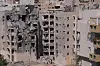 Israel's official surveyors and volunteers check a damaged residential building a day after a direct missile strike, launched from Iran, following the announcement of a ceasefire, in Beersheba, Israel, Wednesday, June 25, 2025. [AP/YONHAP]