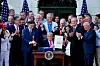 U.S. President Donald Trump displays the signed bill during a ceremony for the ″One Big Beautiful Bill Act″ on the South Lawn of the White House in Washington on July 4. [UPI/YONHAP]