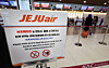 Travelers check in at domestic flight counters at Gimpo International Airport in western Seoul on Jan. 21 after Jeju Air announces that it will completely ban the use of portable battery packs on board all domestic and international flights starting Jan. 22. [YONHAP]