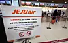 Travelers check in at domestic flight counters at Gimpo International Airport in western Seoul on Jan. 21 after Jeju Air announces that it will completely ban the use of portable battery packs on board all domestic and international flights starting Jan. 22. [YONHAP]