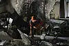 A worker clears rubble of a damaged building, in Tehran, Iran, Wednesday, June 25, 2025, after an Israeli strike on early Tuesday. [AP/YONHAP]