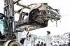 The burnt Mercedes EQE sedan is transferred for investigation in Incheon. The EV explosion injured 23 people and damaged around 880 vehicles in the parking garage. Some 500 households have suffered from electricity outrages for a week. [YONHAP]
