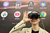A Samsung employee demonstrates the Galaxy XR equipped with the Gemini Live feature at the company’s Gangnam store in southern Seoul on Oct. 22. [YONHAP]