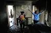 A woman reacts at her home which was destroyed by an Israeli strike on early Tuesday, in Tehran, Iran, Wednesday, June 25, 2025. [AP/YONHAP]