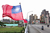 Flags of Taiwan wave on a bridge in Taipei on Dec. 18. [AFP/YONHAP]