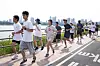 This is me, wearing a pink lanyard for the press, running alongside the Han River in the Seoul city government's annual triathlon festival on May 30. [PARK SANG-MOON]