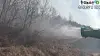 A footage shows Lee Seung-min's pesticide dispenser spraying water toward flames in North Gyeongsang. [SCREEN CAPTURE]
