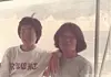 President Lee Jae-myung, left, takes a commemorative photo with his childhood friend Shim Jeong-woon on a boat along the Soyang River en route to Yanggu, Gangwon, during a hiking trip in 1982 while they were students at Chung-Ang University. [SHIM JEONG-WOON]