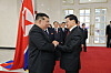 North Korean leader Kim Jong-un greets Laotian President Thongloun Sisoulith during a visit on Oct. 7. [NEWS1]