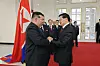 North Korean leader Kim Jong-un greets Laotian President Thongloun Sisoulith during a visit on Oct. 7. [NEWS1]
