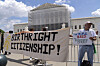 Demonstrators holds up a banner during a citizenship rally outside of the Supreme Court in Washington on May 15. [AP/YONHAP]