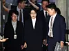 Former first lady Kim Keon Hee, center, leaves Seoul Central District Court in southern Seoul on Aug. 12, after an arrest warrant hearing. [JOINT PRESS CORPS]