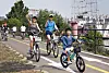 A family of three cycles as a part of the Seoul city government's triathlon festival in Ttukseom Hangang Park in eastern Seoul on May 30. [PARK SANG-MOON]