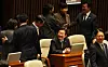 Democratic Party chief Lee Jae-myung, center, greets other lawmakers at the National Assembly in Yeouido, western Seoul, on April 4. [YONHAP]