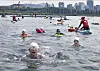Participants swim in the Han River for the 300-meter (984-foot) aquatic race as part of the Seoul city government's three-day triathlon festival in eastern Seoul on May 30. [PARK SANG-MOON]