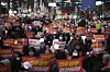 People shout slogans during a rally to celebrate after the Constitutional Court ruled to impeach President Yoon Suk Yeol in central Seoul on April 4. [AP/YONHAP]