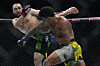 Belal Muhammad, left, kicks Brazil's Gilbert Burns during the first round of a welterweight bout at the UFC 288 mixed martial arts event on May 6, 2023. [AP/YONHAP]