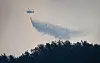 Authorities put out a fire using a helicopter on March 22, a day after a wildfire broke out in the southeastern county of Sancheong, in this photo provided by the South Gyeongsang provincial government. [YONHAP]