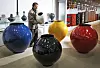 Sohn gazes at the jars he created, which are put on display on the second floor of the Sugok Workshop. [PARK SANG-MOON]