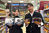 Models hold up GS25's marshmallow cake and tiramisu products inspired by Netflix show 'Culinary Class Wars.' [GS RETAIL]