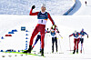 Norway's Johannes Hoesflot Klaebo, center, celebrates as he crosses the finish line during the men's cross country 10-kilometer skiathlon event of the Milan-Cortina 2026 Winter Olympic Games at Tesero Cross-Country Skiing Stadium in Lago di Tesero (Val di Fiemme), on Feb. 8. [AFP/YONHAP]