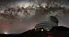 This image captures not only Vera C. Rubin Observatory, a Program of NSF’s NOIRLab, but one of the celestial specimens Rubin Observatory will observe when it comes online: the Milky Way. The bright halo of gas and stars on the left side of the image highlights the very center of the Milky Way galaxy. The dark path that cuts through this center is known as the Great Rift, because it gives the appearance that the Milky Way has been split in half, right through its center and along its radial arms. [VERA C. RUBIN OBSERVATORY WEBSITE]